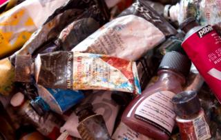 A close up of tubes of paint