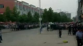 Crowd outside nursery in eastern China