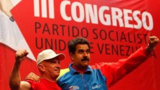 Venezuela's President Nicolas Maduro (right) embraces Gen Hugo Carvajal as they attend the Socialist party congress in Caracas on 27 July, 2014