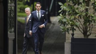 King Philippe of Belgium (left) welcomes chairman of Vlaams Belang party Tom Van Grieken (right) ahead of a meeting at the Royal Palace