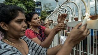 Sri Lankan local people lit candles near to St Anthony Church in Colombo following the bombings