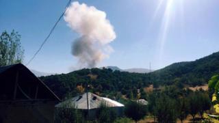 Smokes rise after the attack on 9 October.