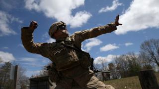 soldier throwing grenade