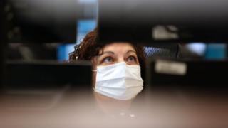 a woman in a face mask