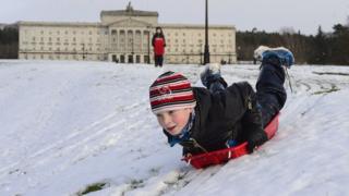 Boy playing in snow at Stormont