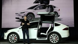Tesla's head, Elon Musk, talks at a company launch event