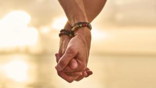 Men holding hands