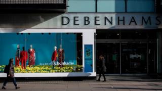 Pedestrians walk past the Debenhams flagship store on Oxford Street on April 12, 2019 in London, England.