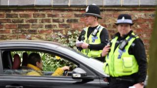 Police officers from North Yorkshire Police stop motorists in cars to check that their travel is "essential"
