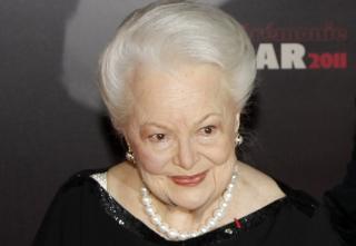 s British US actress Olivia de Havilland (L) arriving for the 36th Cesar awards ceremony held at the Chatelet Theatre in Paris, Franc