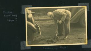 Betty Richard's father shovelling horse manure on a road