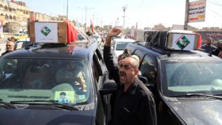 Mourners carry the Iraqi flag-draped coffins of two protesters killed in the protests outside Baghdad"s highly fortified Green Zone on Friday, during their funeral procession in Baghdad, Iraq. Saturday, May 21, 2016.