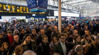 Passengers queue at London Waterloo