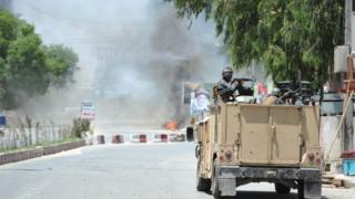Smoke billows from the scene where suspected militants attacked the state-run RTA tv station in Jalalabad, Afghanistan, 17 May 2017.