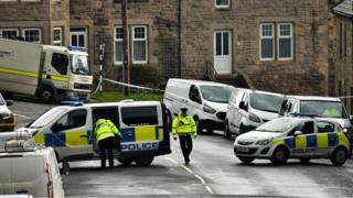 A number of vans could be seen at the village