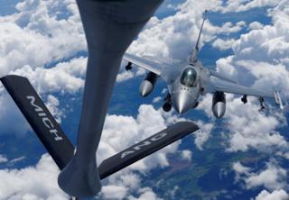 A US Air Force F-16 fighter approaches a KC-135 aerial refuelling aircraft during the US led Saber Strike exercise in the air over Estonia June 6, 2018