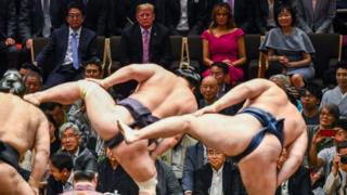 Donald Trump and First Lady Melania Trump watch a sumo battle. 26 May 2019