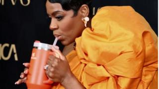 Actress and singer Fantasia Barrino takes a sip from her Stanley cup at the Astra Film Awards earlier this month