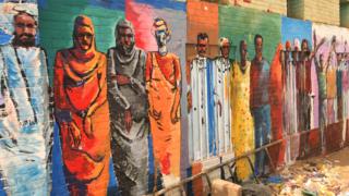 A mural of Sudanese people on a wall in Khartoum, Sudan