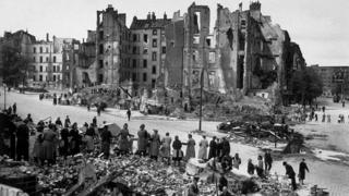 berlin 1945 rubble after nazi chain gang line end allied war getty work february fall ve passing pails long civilians