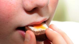 Boy eating a Cadbury's Creme Egg