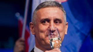 Opposition leader Tomislav Karamarko celebrates his coalition's winning of majority of votes, in Zagreb, Croatia, early Monday, Nov. 9, 2015.