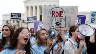 Anti-abortion supporters celebrate outside the US Supreme Court