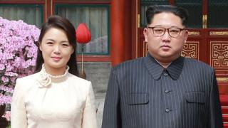 Kim Jong-un and his wife Ri Sol Ju pose for a picture in Beijing on 27 March 2018 in a photo released by KCNA