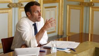 French President Emmanuel Macron attends a video conference at the Elysee Palace in Paris, April 16 2020