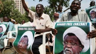 Protesters hold banners calling for the release of Sheikh Ibrahim Zakzaky