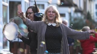 Clapping in Saltburn-by-Sea with tambourine