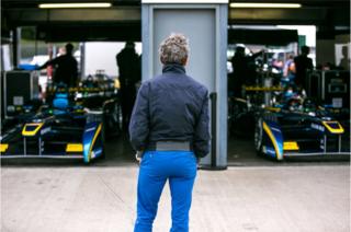 Alain Prost watching his son