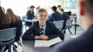 A file image of a boy in a classroom