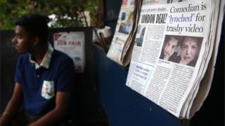An Indian newspaper shows faces of two Indian iconic figures, Sachin Tendulkar, left, and Lata Mangeshkar, right, that are seen superimposed on comedian Tanmay Bhat's face
