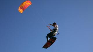 A tourist windsurfs in the resort town of Dahab in the Sinai Peninsula, Egypt, 1 February 2020