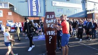 Bury fans outside Gigg Lane