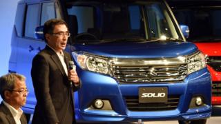 Suzuki Motor president Toshihiro Suzuki introduces the company's 'Solio' wagon in Tokyo