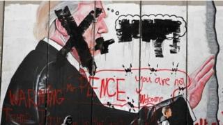 "Pence you are not welcome", says graffiti in the West Bank city of Bethlehem