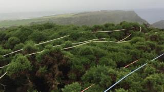 Coastguard rope rescue equipment was deployed from the top of the 150ft cliff above the path