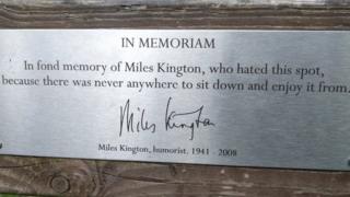 Bench dedication: "In fond memory of Miles Kington, who hated this spot, because there was never anywhere to sit down and enjoy it from."