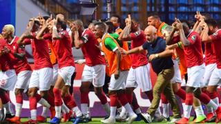 Les joueurs de l'équipe nationale de football de Madagascar célébrant leur victoire