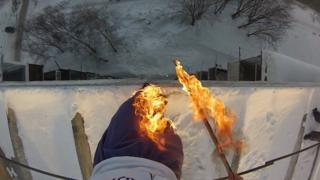 Alexander Chernikov lit his trousers on fire before jumping into a snowbank. Video of the dangerous stunt went viral online