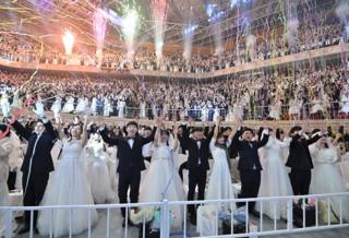 Couples celebrate at a mass wedding ceremony organised by the Unification Church in Gapyeong