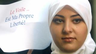 A woman takes part in a 2004 protest against a French ban on Muslim headscarves in schools