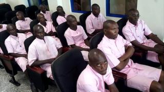 Phocas Ndayizera (ubanza imbere iburyo) areganwa n'abandi 12 gutegura iterabwoba