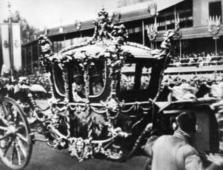 The Royal Coach passing the television camera at Apsley Gate.