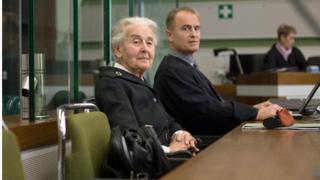Ursula Haverbeck, accused of denying the holocaust, sits with her lawyer Wolfram Nahrath in a courtroom in Berlin.
