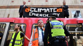 Protestors on top of a train during an Extinction Rebellion protest
