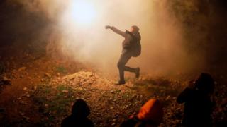 US border agents fire tear gas at migrants on the Mexican border