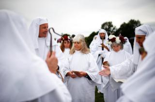 Members of the Druid Order take part in a ceremony to celebrate the autumn equinox